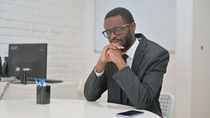 Angry Young Businessman at Office Desk