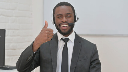 Cheerful Black Man with Headset Showing Thumbs Up
