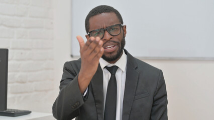 Angry Young African Businessman Pointing and Yelling