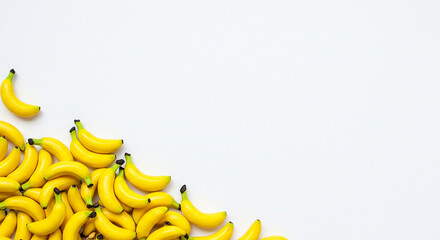 Mini Bananas on White Background – Creative Fruit Composition with Copy Space
