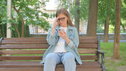 Casual Woman with a Smartphone and an Expressive Gesture