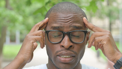 Close-up of a Man with a Painful Expression, Headache