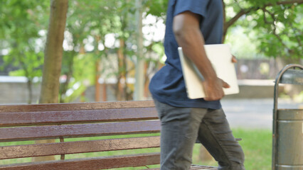 African American Man Leaving Park with Laptop