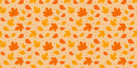 Seamless vector pattern with autumn leaves on beige background