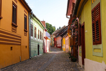 Medieval Street with Colorful Houses in Sighisoara, Romania – Historic Architecture and Cultural Heritage