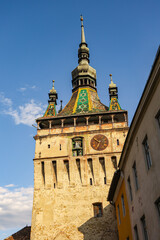 Obraz premium Famous Clock Tower in Historic Sighisoara, Mures County, Romania – Medieval Landmark and Cultural Heritage 