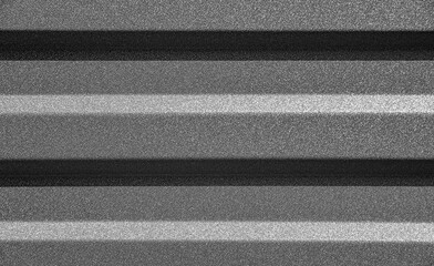 Corrugated metal sheet showcases its uniform, textured surface with strong vertical lines and a...