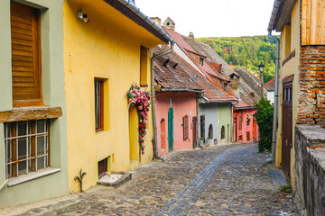 Medieval Street with Colorful Houses in Sighisoara, Romania – Historic Architecture and Cultural Heritage