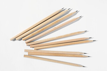 Many graphite pencils on white background, flat lay
