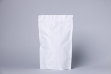 One zipper stand-up pouch on light grey background. Mockup for design