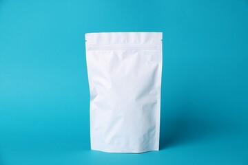 One zipper stand-up pouch on light blue background. Mockup for design