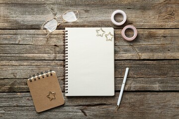 Flat lay composition with open blank notebook on wooden table
