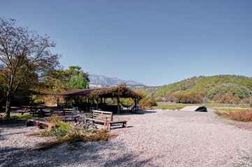 Rustic Outdoor Picnic Spot With Wooden Benches and Mountain Views