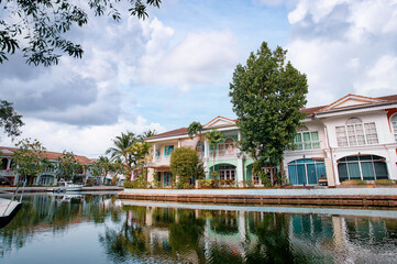 Beautiful Waterfront Colonial-Style Homes With Reflections on Tranquil Canal