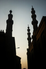 Mosque minarets silhouetted against the sky in Cairo, Egypt