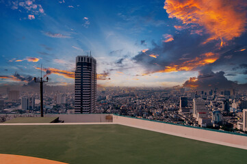 Panoramic Cityscape View with Vibrant Sunset from a Modern Rooftop