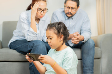 Stressed mother and father worried about trouble with a lazy little child girl at home