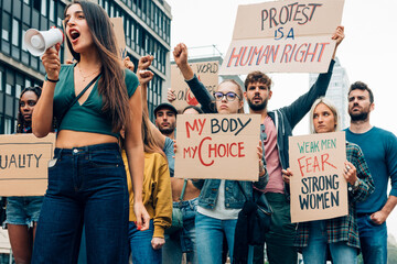 Crowd of young activists marching for their rights and equality