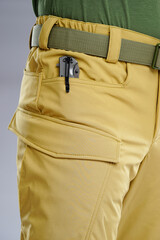 Close-Up View of Tactical Pants Pocket with Foldable Knife