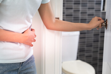 diarrhea in bathroom. Hurt woman touch belly  stomach ache painful. colon inflammation problem,...