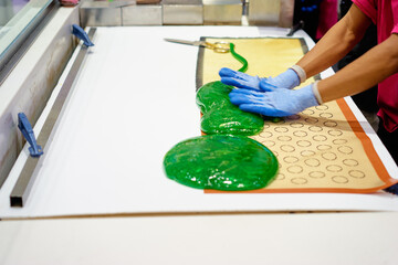Candy Making Process With Green Sugar and Gloved Hands in a Kitchen
