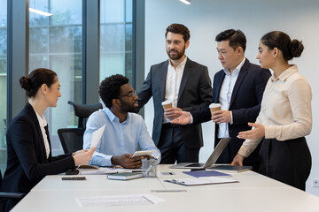 A diverse group of business professionals in a modern office setting, engaged in a meeting with a...