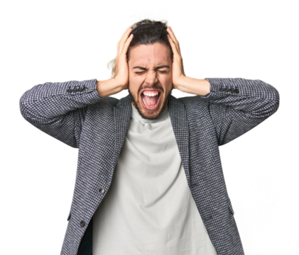 Young businessman in casual blazer covering ears with hands trying not to hear too loud sound. - Powered by Adobe