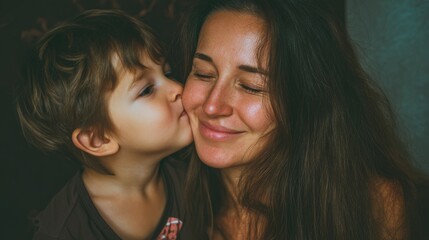 Mother son embrace happily portrait, friendship. Joyful mom, kid, love and connection. Cozy home. Childhood, motherhood. Loving family, happiness. Smiling mum and her little child hug, kiss cheek.
