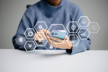 Businesswoman hand working digital marketing media in virtual screen with mobile phone and modern...