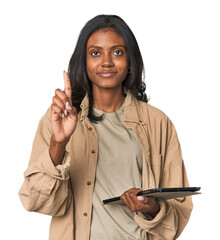 Young Indian woman with digital tablet showing number one with finger.