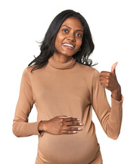Young Indian pregnant woman smiling and raising thumb up