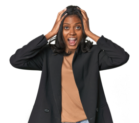 Young Indian woman in business suit screaming, very excited, passionate, satisfied with something.