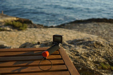 Action camera recording sea sunset, concept of travel, tourism, photography description: an action...
