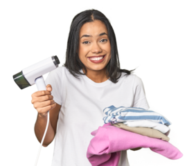 Positive Latina using a steam iron on clothes