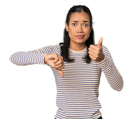 Young Filipina woman showing thumbs up and thumbs down, difficult choose concept
