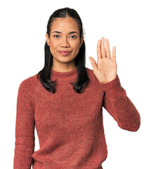 Young Filipina woman smiling cheerful showing number five with fingers.