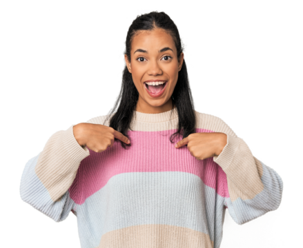 Young Filipina woman surprised pointing with finger, smiling broadly.