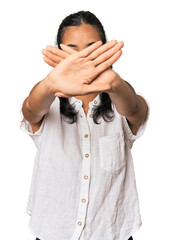 Young Filipina woman doing a denial gesture