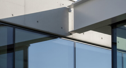 Modern architectural detail of steel beam connected to concrete wall, this construction background shows amazing glass and strong shadow