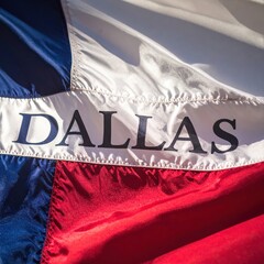 Close-up of dallas text on texas flag with blue, white, and red stripes