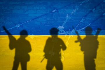 Conceptual image of war between Russia and Ukraine with shadow of soldier against wall with flags