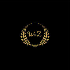Naklejka premium WZ beautiful feminine and elegant wedding monogram initial logo with circle floral gold