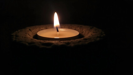 Tealight Candle in Dark Stone Holder with Soft Ambient Glow