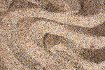 background of beach sand texture with wave patterns