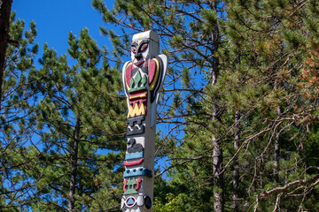 Colourful Totem pole on island in Thousand Islands Ontario Canada