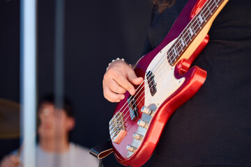 Rock band performs during live concert at outdoor festival in the summer