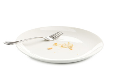 Dirty plate with bread crumbs and fork isolated on white