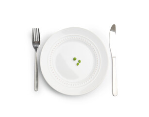 Plate with fresh green peas and cutlery isolated on white, top view