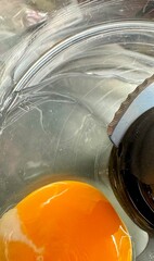 Top view of raw egg in food processor