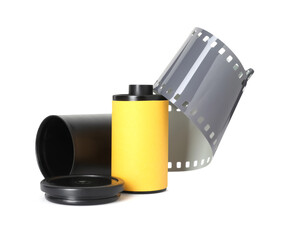 Roll of photographic film and canister isolated on white